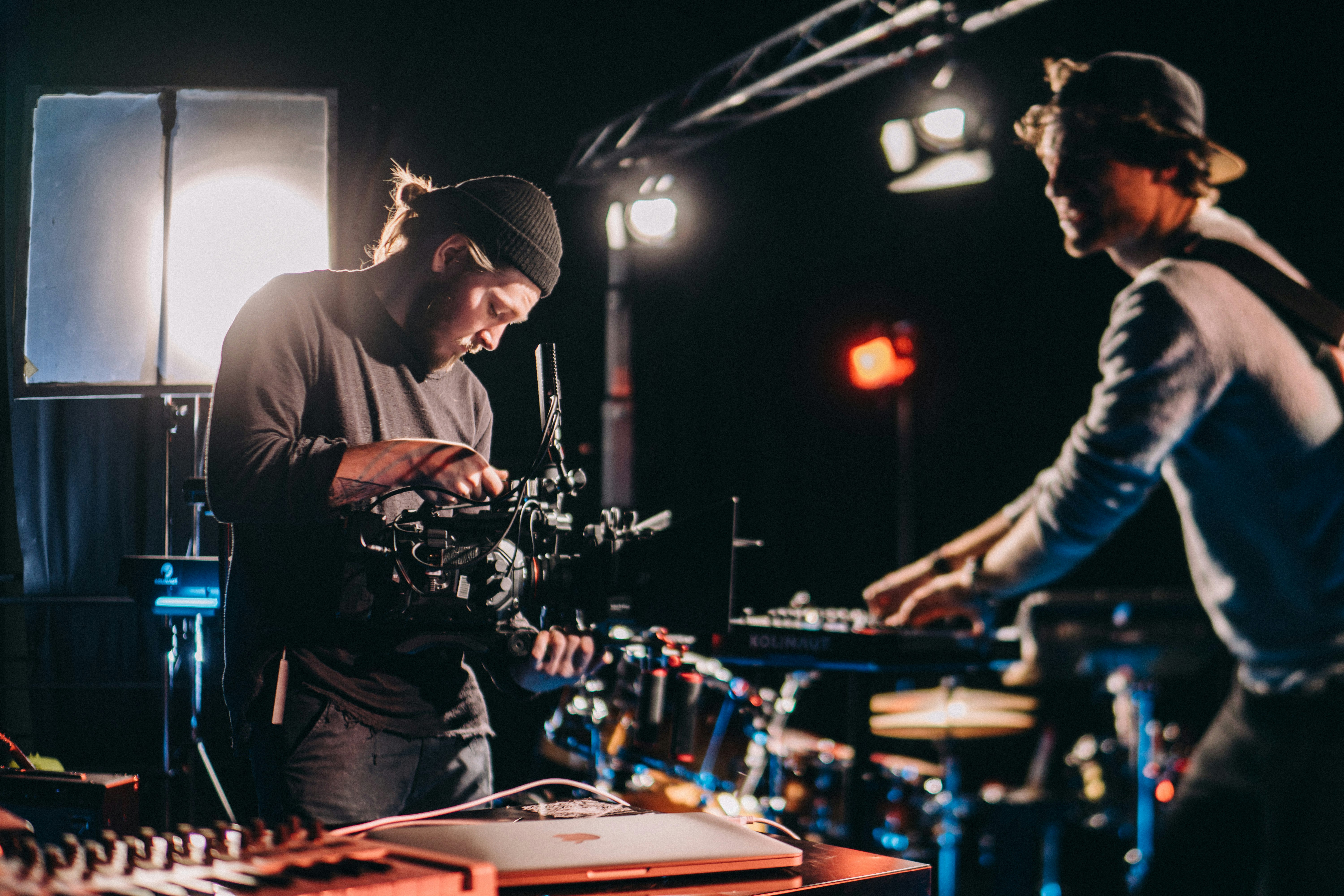 selective focus photo of man holding black camera